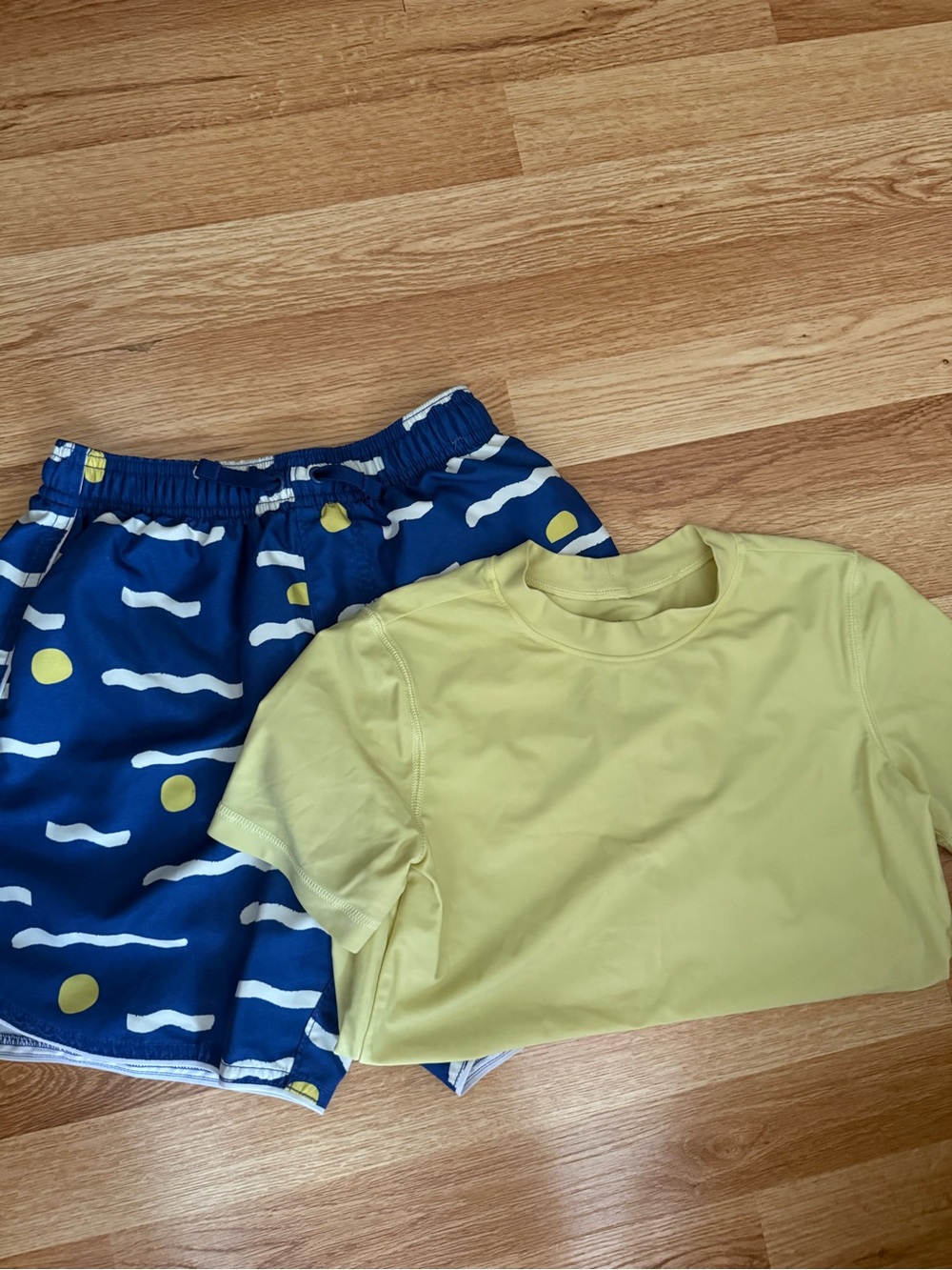 Yellow Short Sleeve Rashguars with Navy Patterned Swim Shorts